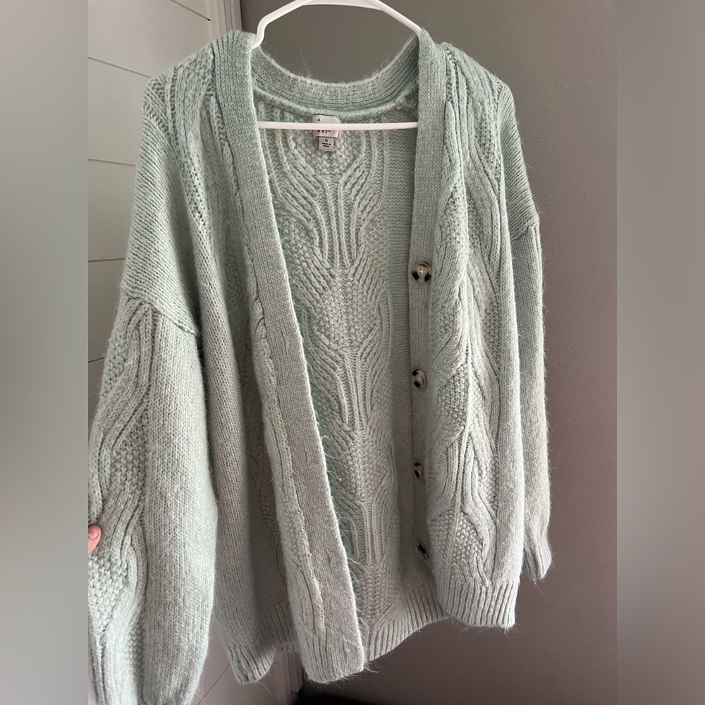 Mint green sweater with stitch detail